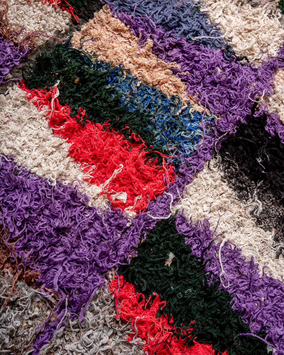Modern designer vintage handcrafted Berber rug from Morocco. Boucherouite with beautiful colors and patterns.